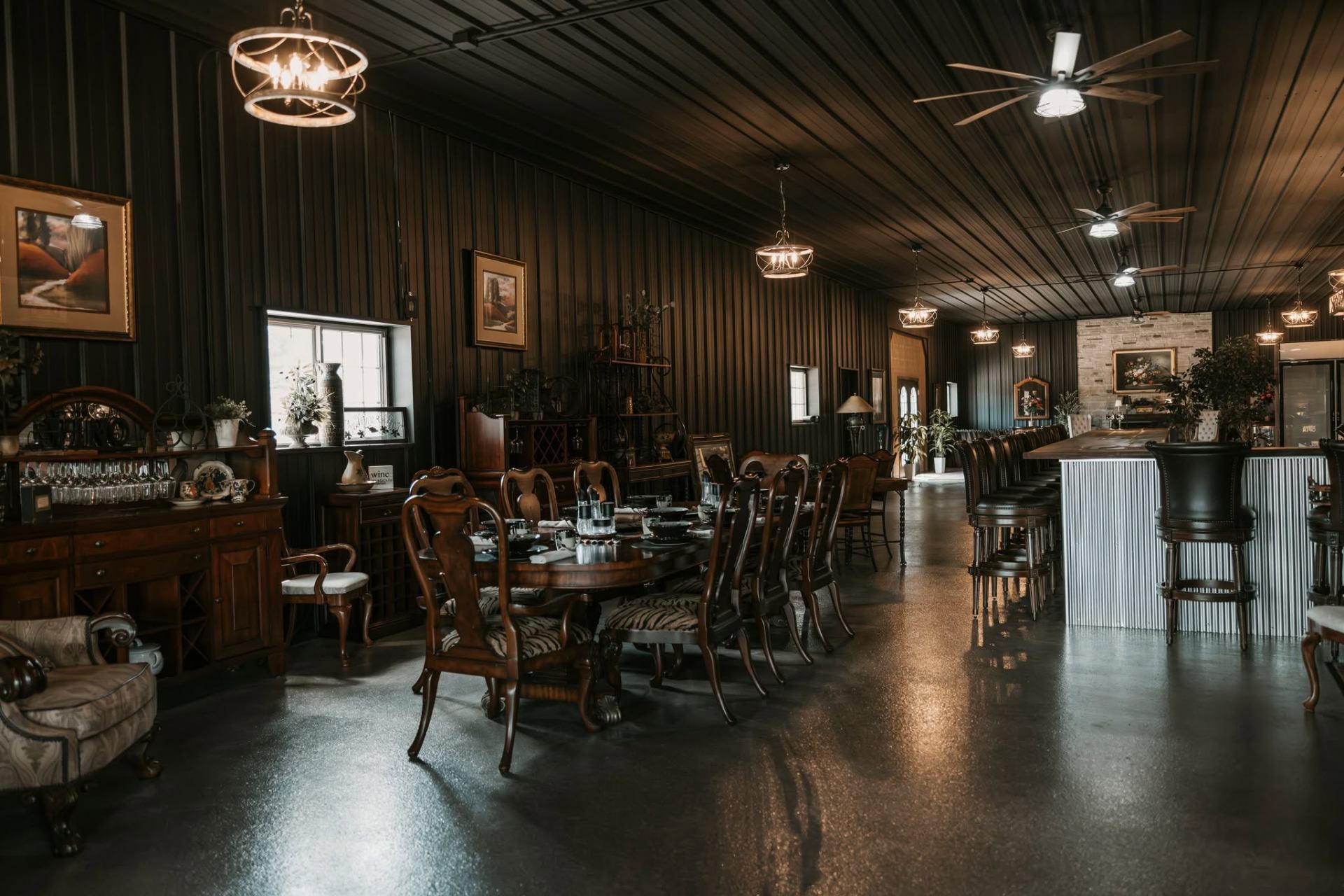 Dining tables and bar seating along the length of the venue